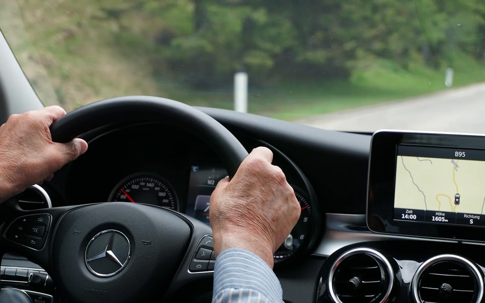 Man, driving and car